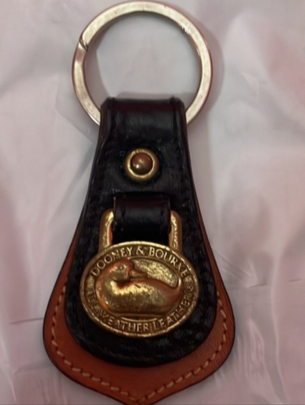 Dooney & Bourke Black and Brown Leather Key Ring with Brass Duck Medallion